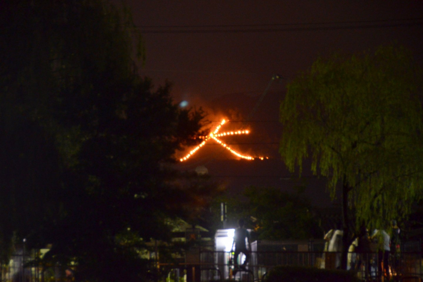 The Kanji character symbolising "Large" being set ablaze on the Daimonji mountain.