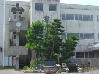 The junior high school is still standing, empty, but saved for a little longer in case it&#39;s needed again for evacuation. Soon it will be torn down. Until then, the clock marks the time that the earthquake struck - 2:46pm