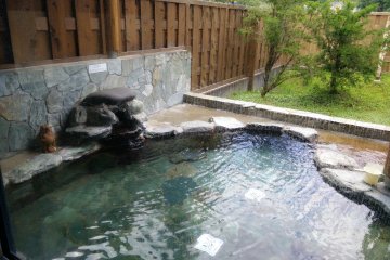 <p>The outdoor stone bath</p>