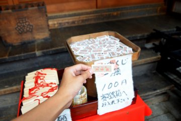 <p>Omikuji in a shrine at Takayama&nbsp;City. This one does not requires one to shake the box for a number. You simply pick from a pile of&nbsp;Omikuji.</p>