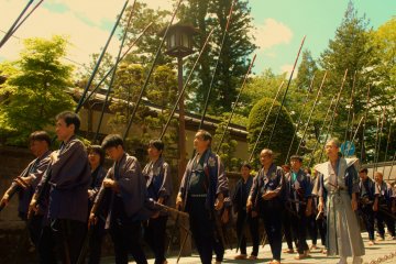 <p>Processioners not only wear traditional clothing but also are equipped with replicas of traditional weapons used during the times, here we see the long spear or Yari.</p>