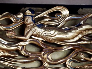 Beautiful gold carving of a flying Goddess of Mercy