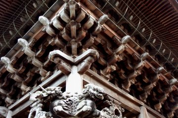 <p>Closer look at the intricate carvings and wooden structure</p>