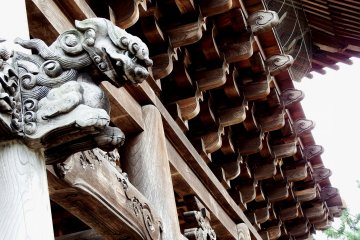 <p>Beautiful wooden architecture, and a guardian dog carving</p>