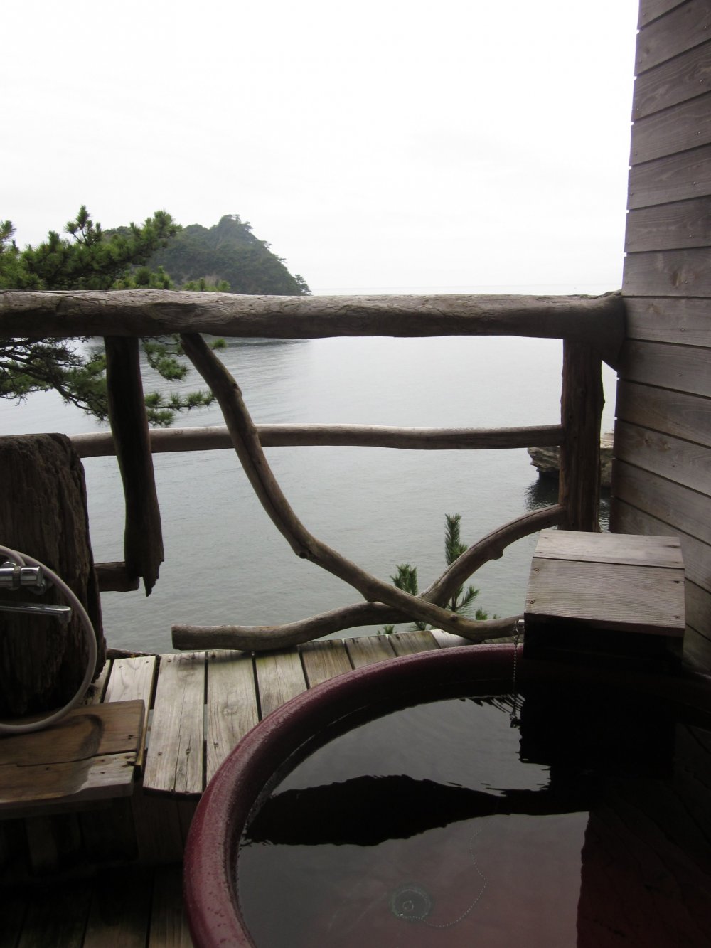 Placed on the balcony of your suite, a private bath for two looks over the peaceful view of Suruga Bay