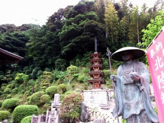 The statue of Kobo-Daishi (Kukai) and the five-storied pagoda at the foot of the hill