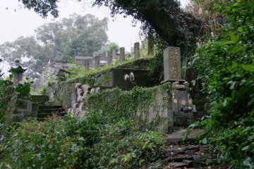 The cemeteries sit on a slope behind the temples.