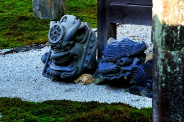 <p>These roof ornament tiles symbolize a perspective of Buddhism</p>