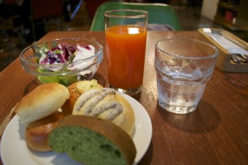 <p>Different types of bread pieces, salad, and my vegetable juice&nbsp;</p>