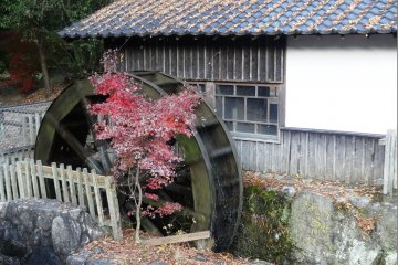 <p>A waterwheel sits right next to the shuttle bus stop for Kunenan</p>