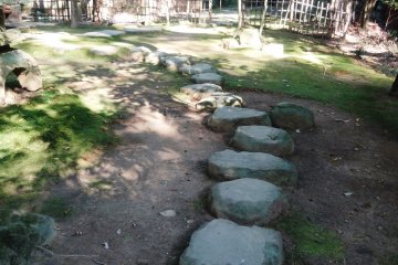 <p>A stone path leads back to an old teahouse</p>