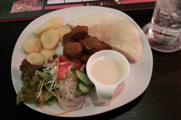 <p>The falafel sandwich. It doesn&#39;t all fit in the pita bread, but it tastes good.</p>