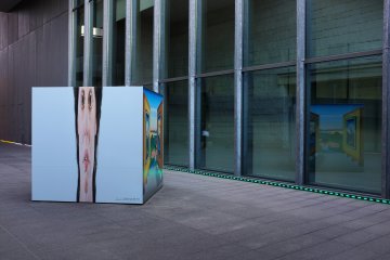<p>A promotional box displaying the current exhibition</p>