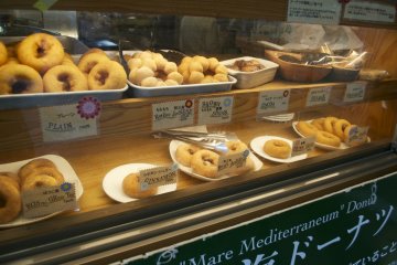 <p>Fresh, homemade donuts with different toppings fried in olive oil</p>