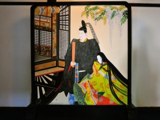 The screen displayed in the corridor between Kachoden Hall and Kogosho Hall features&nbsp; a painting of elegant aristocrats