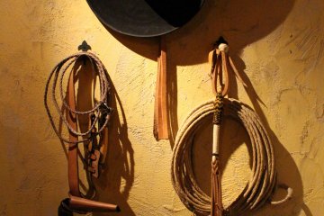 <p>Cowboy gear on the walls</p>
