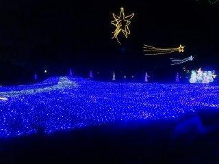 A sea of blue LED lights carpets the ground