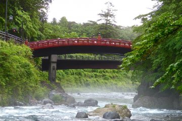 View of Shinkyo Bridge from the riverbank, early in the morning.
