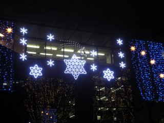 &nbsp;Illuminations hang on the facade of a building along Jozenji Avenue