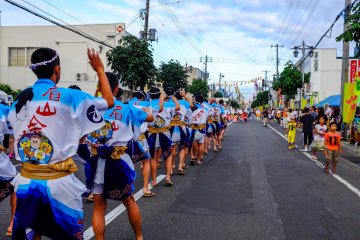 <p>Colourful dancers in the streets during the Kutchan Matsuri.</p>