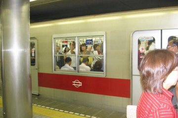 Boarding a Midosuji line train