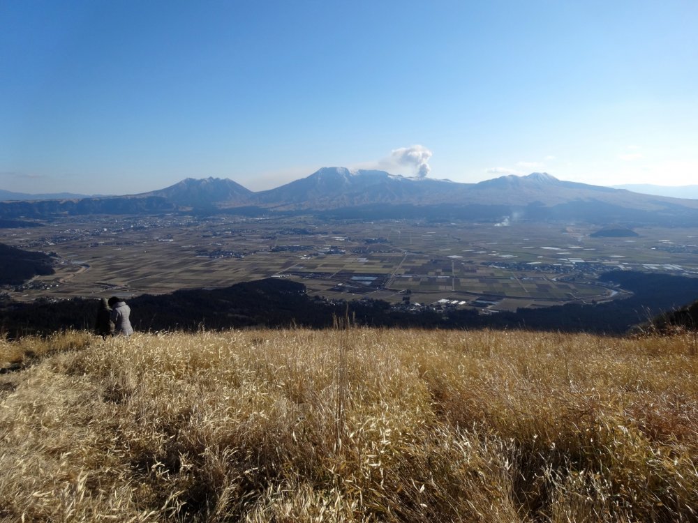 A currently smoking Mt Aso can be seen from the Daikanbo lookout on Aso&#39;s scenic Milk Road