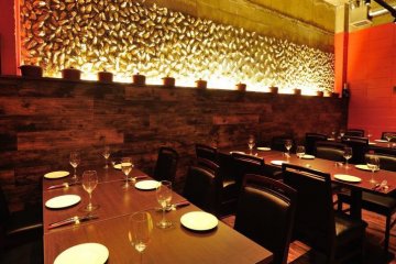<p>Part of the dining area. The back wall is made from oyster shells</p>