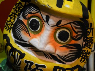 Yellow Daruma Doll displayed at the entrance of Izakaya Aji-Tora. The yellow color of course represents Hanshin Tigers!
