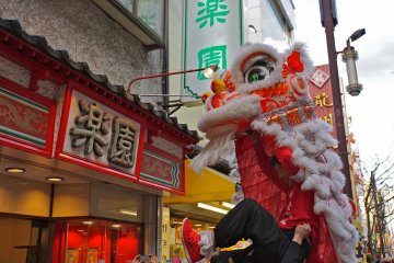 <p>A glimpse of the acrobatic lion dancer as he approaches a merchant during Chinese Lunar New Year &nbsp;</p>