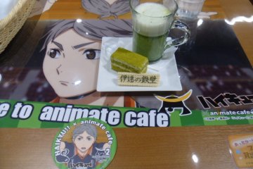 <p>&quot;Date&#39;s Iron Wall&quot;, a matcha (green tea) cake set. Each order comes with a collectable coaster. &nbsp;</p>