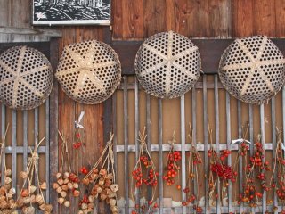 A local resident hangs their chilli&#39;s out to dry in Shirakawa-go village