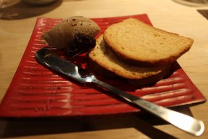 An appetizer of toast and a house specialty, chicken liver mousse. Sweet and delicious