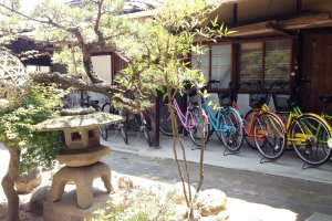 The candy colored bicycles bring the traditional courtyard to life.