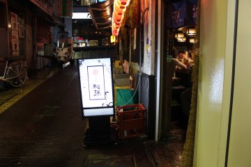 <p>A restaurant tucked inside an alley</p>