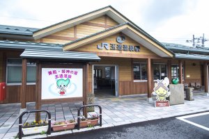 The facade of the JR Tamatsukurionsen Station, built to resemble a wooden onsen hut. Prominent signs everywhere tell you that you&#39;ve reach one of the best onsen towns in Japan.