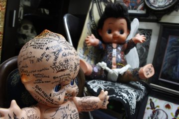 <p>Two dolls with some interesting tattoos.&nbsp;</p>