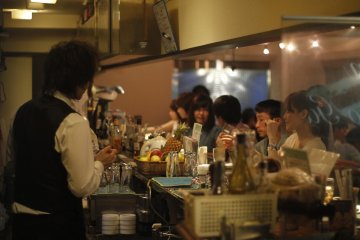 <p>Customers ordering at the bar.&nbsp;</p>