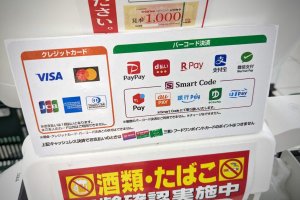 Credit card and QR code payment examples in a Japanese store