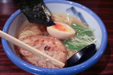 Shio ramen is characterized by its transparent broth and light taste (topped with grilled chaashuu, tamago, nori, and some greens)...