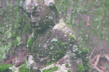 Moss covering an ancient statue