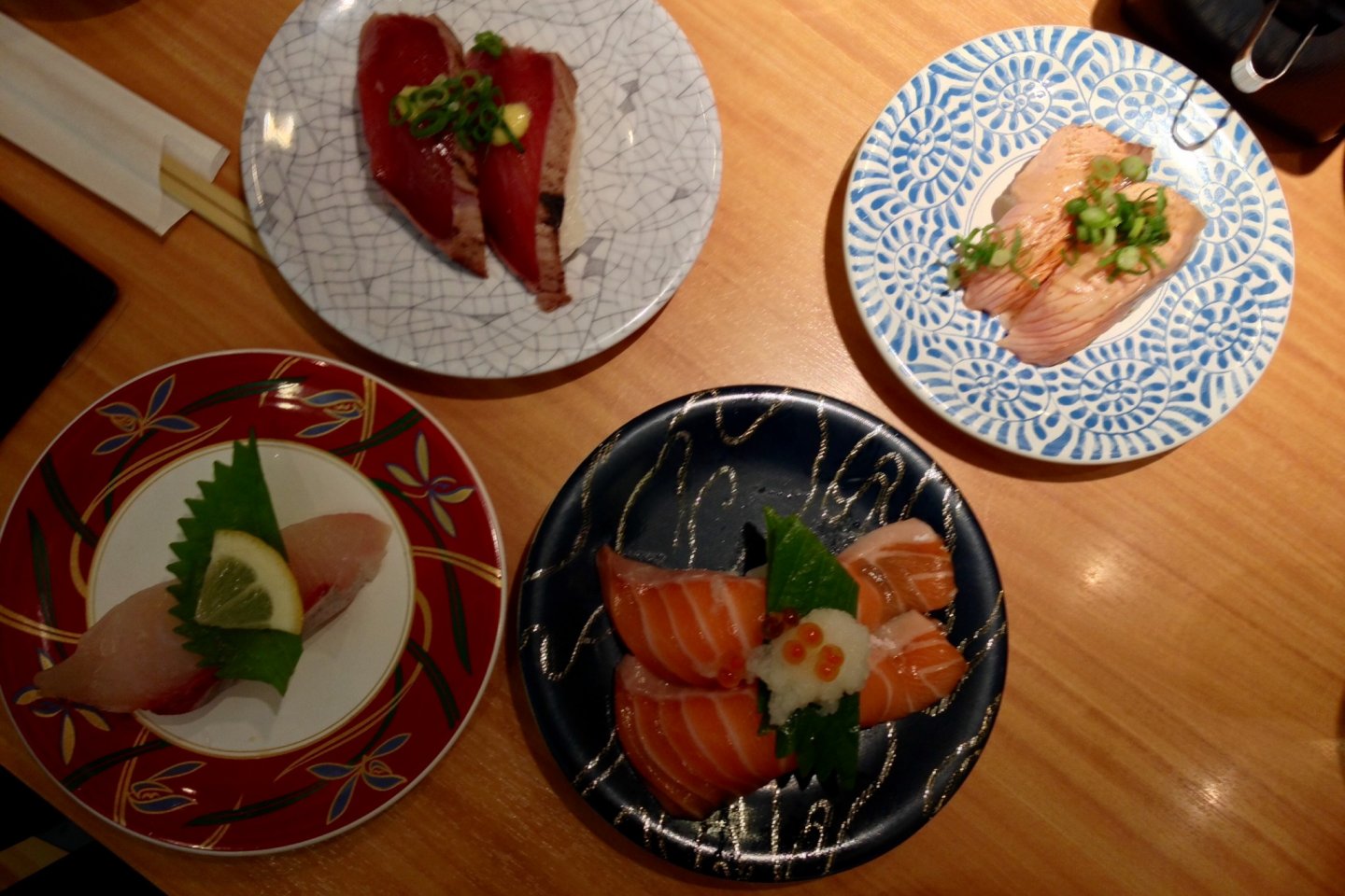 Clockwise from top-left: katsu tataki, the "Mmmm," inducing aburi shio negi salmon, salmon toro and kanpachi