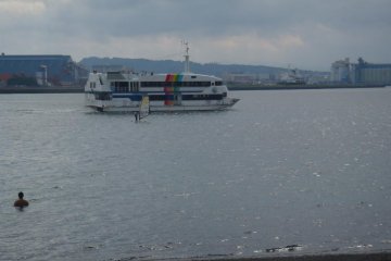 windsurfer and ferry