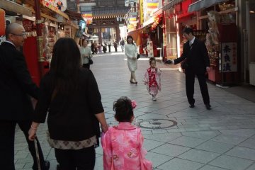 Two pretty girls in kimono; one coming and one leaving!