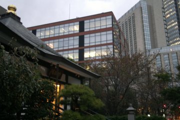 <p>Myoko Temple nestled amongst modern high-rise buildings.</p>