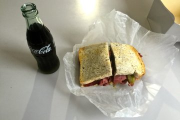 <p>Coke and a pastrami sandwich</p>