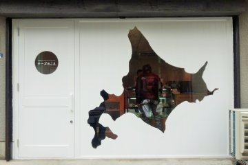 <p>The front of the shop with a cut-out of Hokkaido, where all the cheese here comes from</p>
