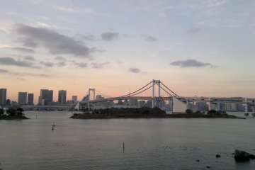 <p>The white color of the bridge starts to shine against the skyline.</p>

