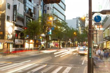 Tree-lined Kokutai-doro, on the southern side of Tenjin, has shopping, cafes, and restaurants