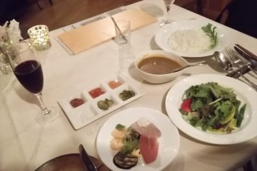 <p>My dinner: salad, curry, pickles, jam, juice</p>