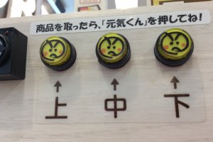 The leftmost button is to return the vehicle that delivered food from the top track, the middle button returns the vehicle from the middle track and, you guessed it, the right button will return the vehicle from the bottom track. If you don`t return the vehicle it will block the tracks and others can`t order, nor can your next order come